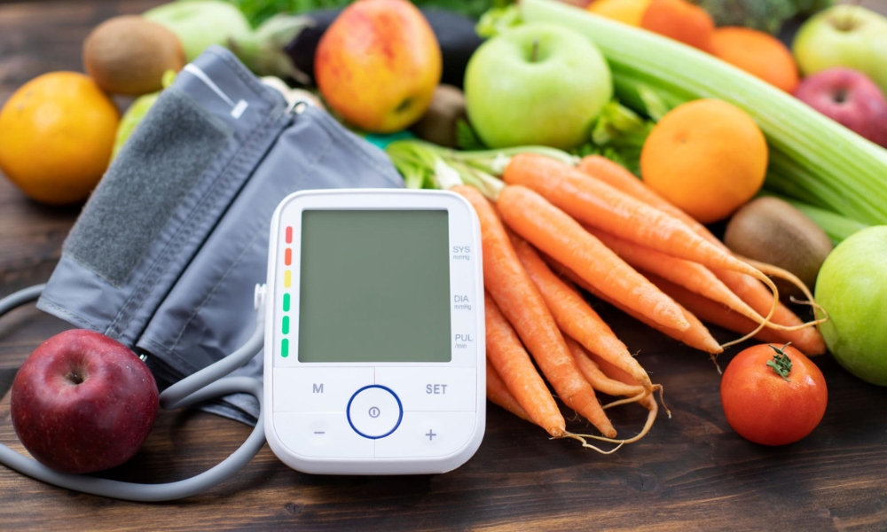 Primary care physician checking a patient's blood pressure during a hypertension management visit in Round Rock, TX