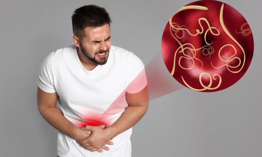 Physician evaluating abdominal pain symptoms during a primary care examination for digestive health
